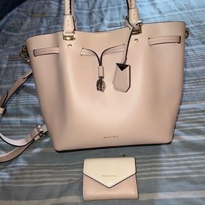 Michael Kors handbag/crossbody used with a few stains on the inside.